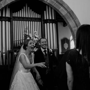 "As I stumbled out of a rickety LandRover, Dave (the Vicar) was waiting. He greeted me by name and then proceeded to instruct me to get some really great shots during Louise and David’s wedding ceremony. As lots of my fellow pro photographers will tell you, a great vicar is hard to come by, so, clergy like Dave fill me with hope. Because weddings should be happy momentous occasions, and if the couple want that bit documenting, then we should all work together to make it as symbiotic, as relaxed and (for me) as unobtrusive as possible. Dave is the Man. He conducted Louise and David’s wedding with fun, laughter, some sincere words of advice, threw in a bit of seriousness, and quite frankly, made all the congregation (even non believer me), feel like they were part of something special. Because we were… wedding ceremonies are special." Louise & David